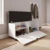 White ottoman storage bench with toys and books
