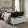 Mobile storage bench at end of bed in modern bedroom